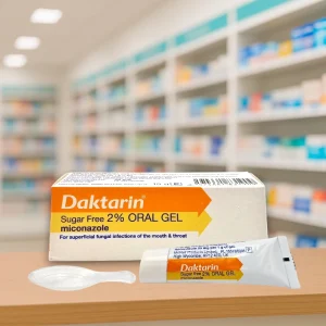 Daktarin Oral Gel 15g tube with outer carton. Packaging is white with orange and blue accents, showing the name “Daktarin Oral Gel” and active ingredient miconazole 20mg/g. Antifungal medicine for oral thrush and mouth infections.
