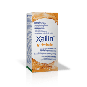 Image of a white and orange box of Xailin® Hydrate 0.3% Eye Drops. The front of the box prominently displays the product name "Xailin® Hydrate" along with "Hypromellose 0.3%" and "Lubricating Eye Drops." The packaging indicates that the drops are suitable for soothing irritated and dry eyes, and are contact lens friendly. The box contains 10ml of the product. Various languages are used to convey the product's purpose and benefits, such as English, French, Italian, and Spanish. The manufacturer's name, VISUfarma, is also visible at the bottom of the box.