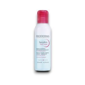 Bioderma Sensibio H2O Eye Biphasic Micellar Makeup Remover bottle. The bottle is cylindrical with a red flip-top cap. The label is white with black and pink text, displaying the brand name 'Bioderma' at the top. The product name 'Sensibio H2O eye' is highlighted in pink. The description states that it is a biphasic micellar makeup remover for waterproof makeup, designed for sensitive eyes and lips. The bottle contains 125 ml (4.2 FL.OZ.). The NAOS logo is visible at the bottom.