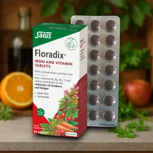 Floradix Iron Tablets pack of 84. White and orange packaging with red banner displaying “Floradix Iron Tablets”. Contains iron, vitamins B1, B2, B6, B12, C, niacin, folic acid and herbal extracts. Vegan, gluten-free and lactose-free supplement for energy, fatigue reduction and red blood cell support.