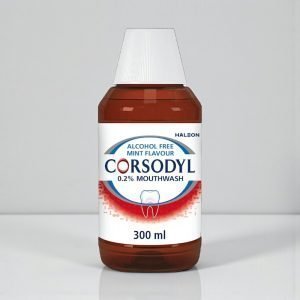 Corsodyl mint Alcohol Free Mouthwash 300ml bottle, white and blue packaging with red Corsodyl branding, labelled chlorhexidine digluconate 0.2% mouthwash for gum disease treatment.