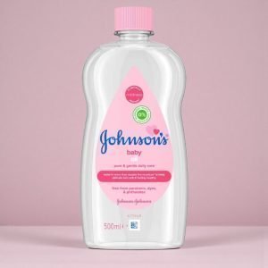 Johnson’s Baby Oil bottle in clear plastic with pink cap, showing “Johnson’s Baby Oil” label, available in multiple sizes including 200ml, 300ml and 500ml. Clear mineral oil visible through the bottle.