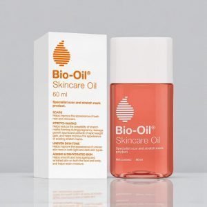 Bio-Oil Specialist Skincare Oil 60ml bottle with orange liquid and white cap, shown alongside its white and orange retail box labelled “Bio-Oil”. Designed for scars, stretch marks, uneven tone, ageing and dehydrated skin.