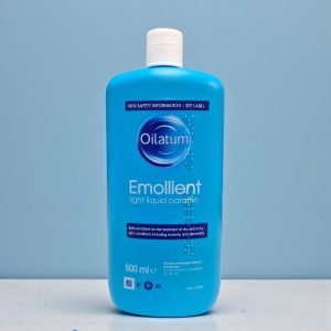 Oilatum Emollient Bath Additive 500ml bottle with white and blue packaging, labelled “Oilatum Emollient” and “Bath Additive”, liquid paraffin emollient for dry skin, eczema and dermatitis.