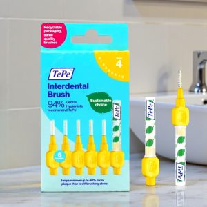 TePe Interdental Brushes Yellow 0.7mm pack showing yellow-handled brushes with plastic-coated wire and fine bristles, designed for cleaning between teeth.