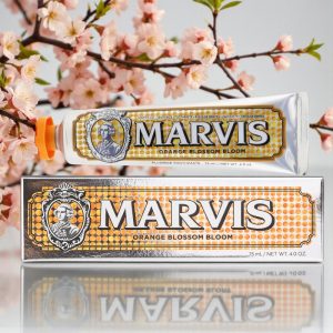 Marvis Orange Blossom Bloom Toothpaste 75ml tube and box, silver packaging with orange blossom graphics and white Marvis branding text.